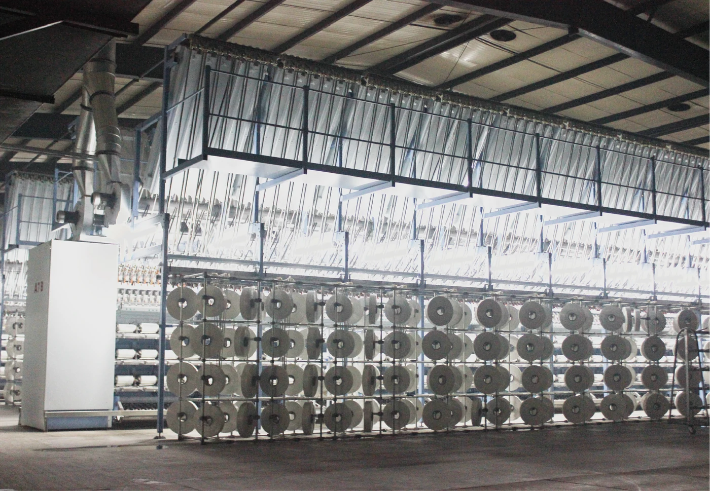 Texturing workshop with industrial yarn equipment