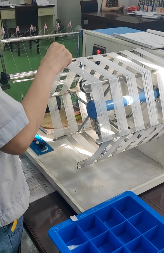 Technician performing yarn fineness testing
